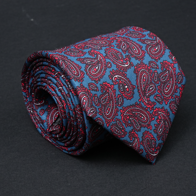 a red and blue paisley tie on a black background