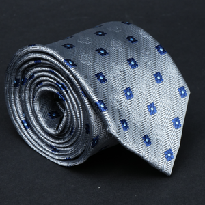 a close up of a tie on a black surface