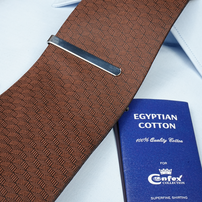 a close up of a tie and a passport