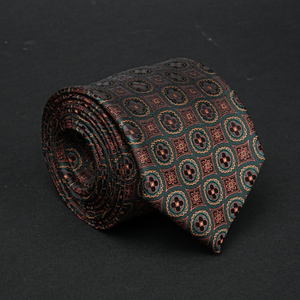 a close up of a tie on a black surface