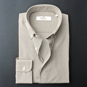 a dress shirt with a tie on a black background