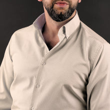 a man with a beard wearing a dress shirt