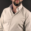 a man with a beard wearing a dress shirt