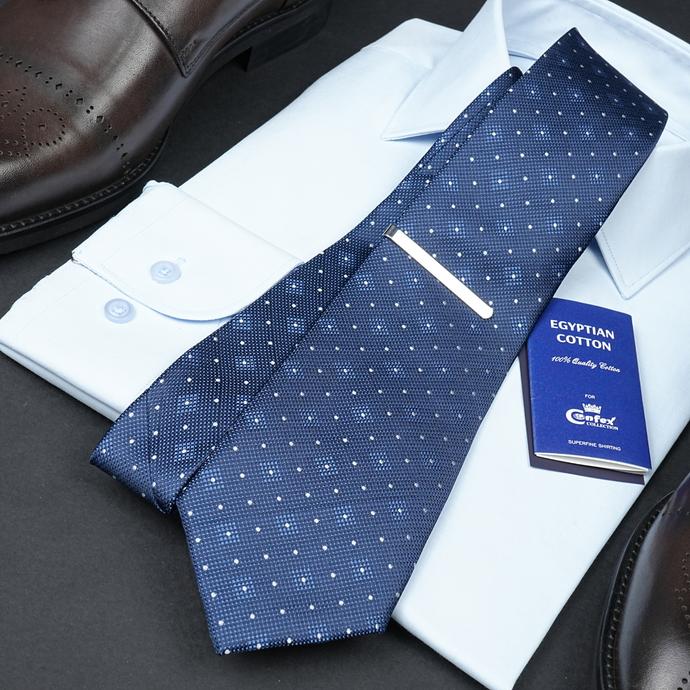 a blue tie and a white shirt and a brown shoe