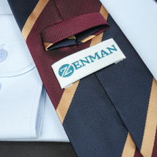 a close up of a tie with a name tag on it