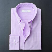 a purple and white checkered shirt on a black background