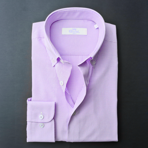 a purple and white checkered shirt on a black background