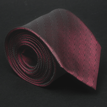 a close up of a tie on a black surface