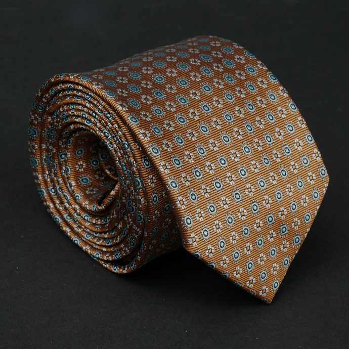a close up of a tie on a black surface
