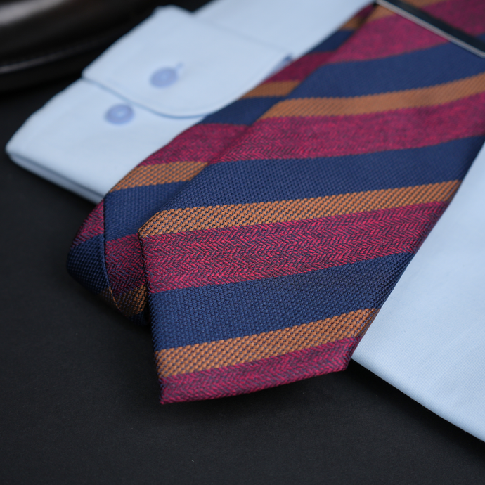 a close up of two ties on a table