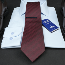 a close up of a tie and a shirt