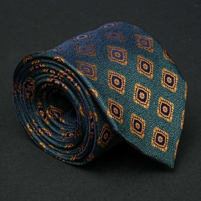 a close up of a tie on a black surface