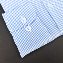 a close up of a blue and white checkered shirt