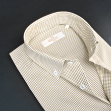 a close up of a shirt on a black surface