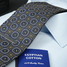 a close up of a tie and a blue book
