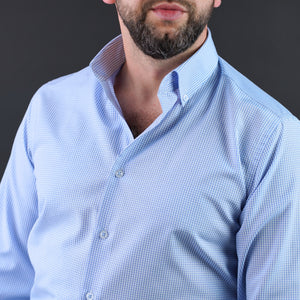 a man with a beard wearing a blue shirt