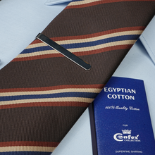a close up of a tie and a book
