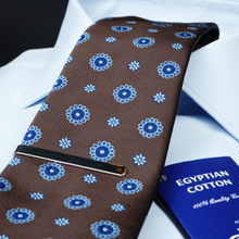 a close up of a tie and a passport