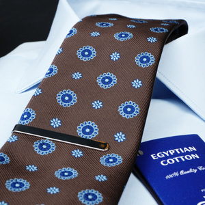 a close up of a tie and a passport
