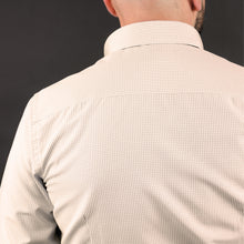 a man with a bald head wearing a dress shirt