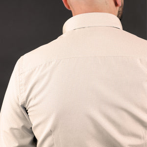 a man with a bald head wearing a dress shirt