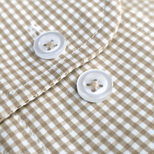 a close up of a button on a shirt
