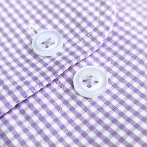 a close up of a purple and white checkered shirt