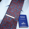 a red and blue tie and a blue book