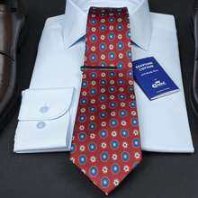 a red tie with a blue book on it