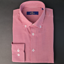 a red and white checkered shirt on a gray background