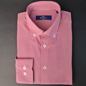 a red and white checkered shirt on a gray background