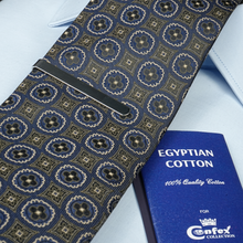 a blue book and a blue tie on a white shirt