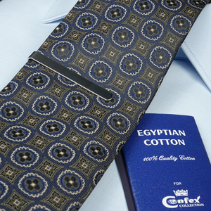 a blue book and a blue tie on a white shirt