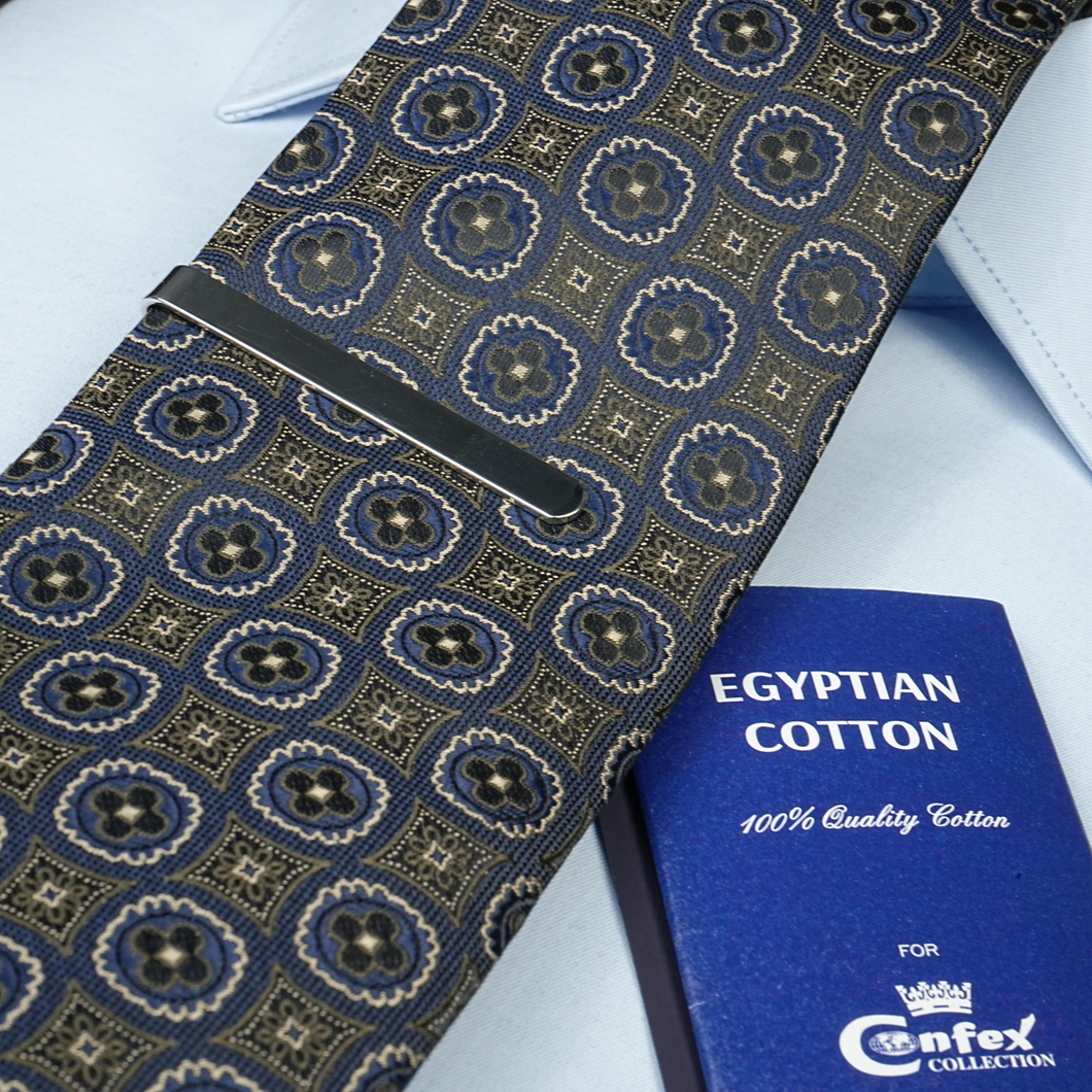 a blue book and a blue tie on a white shirt