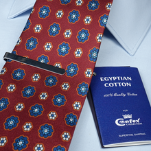 a red tie with a blue book next to it