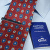 a red tie with a blue book next to it