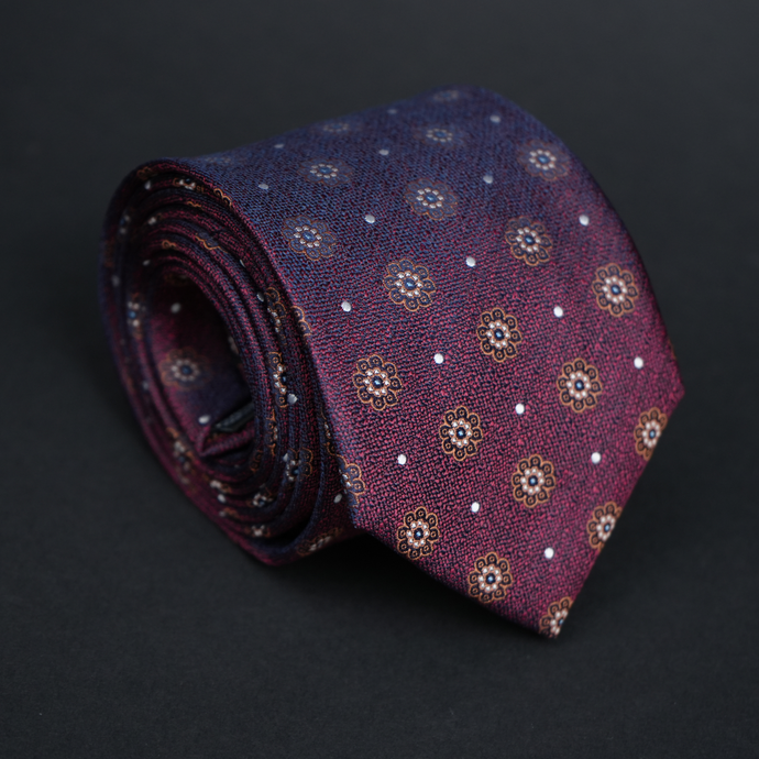 a close up of a tie on a black surface