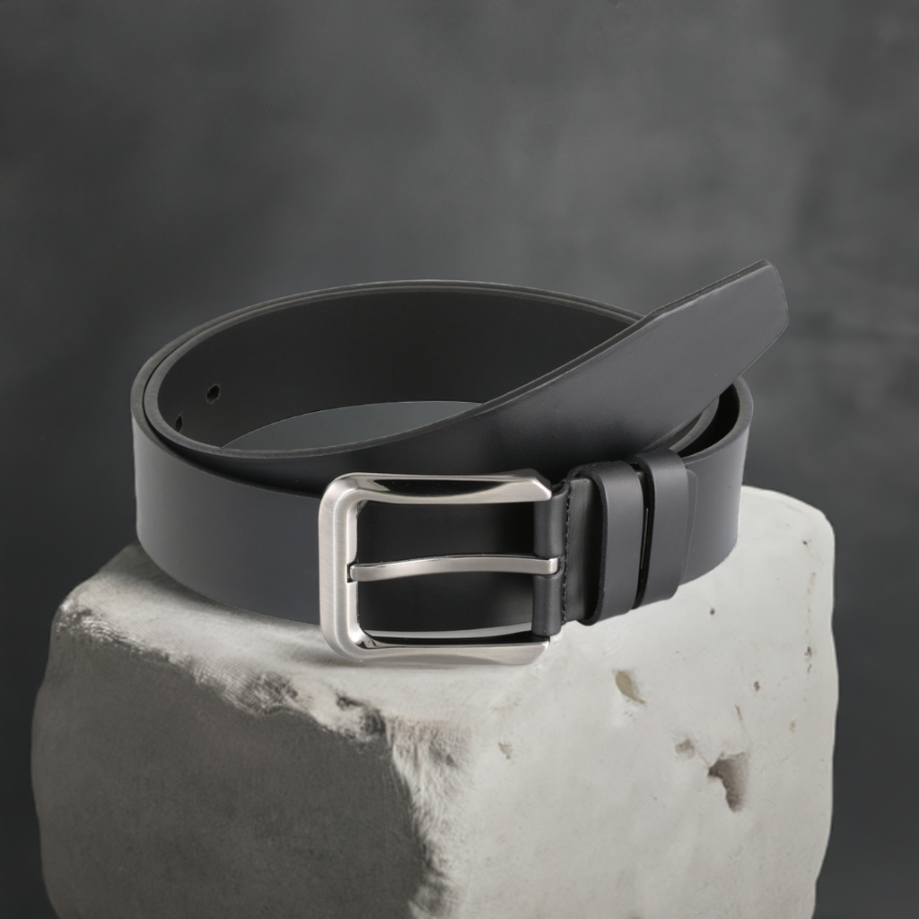 a black belt sitting on top of a rock