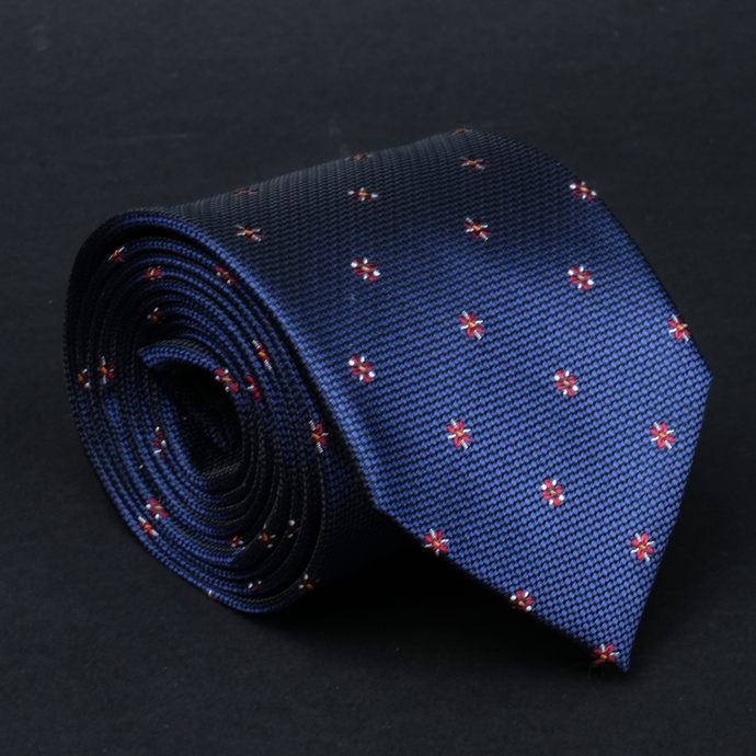 a close up of a tie on a black surface