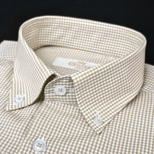 a brown and white checkered shirt with a button down collar