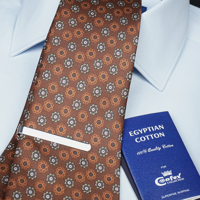 a close up of a tie and a book