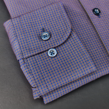 a close up of a purple and blue checkered shirt