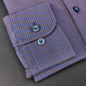 a close up of a purple and blue checkered shirt