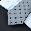 a close up of a tie and a dress shirt