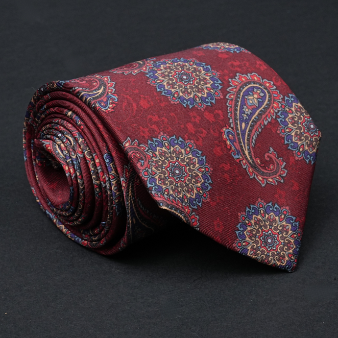 a close up of a tie on a black surface