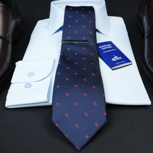 a blue tie with red crosses on it