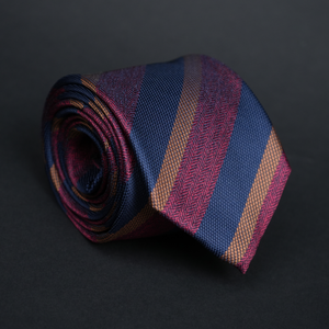 a purple and blue striped tie on a black background