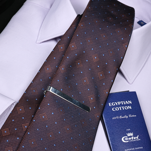 a tie and a passport on a white shirt