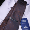 a tie and a passport on a white shirt