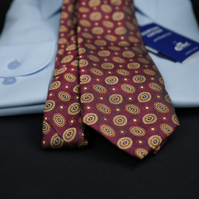 a close up of a tie on a shirt